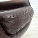 1970s, set of two swivel lounge chairs with footstool, leather.