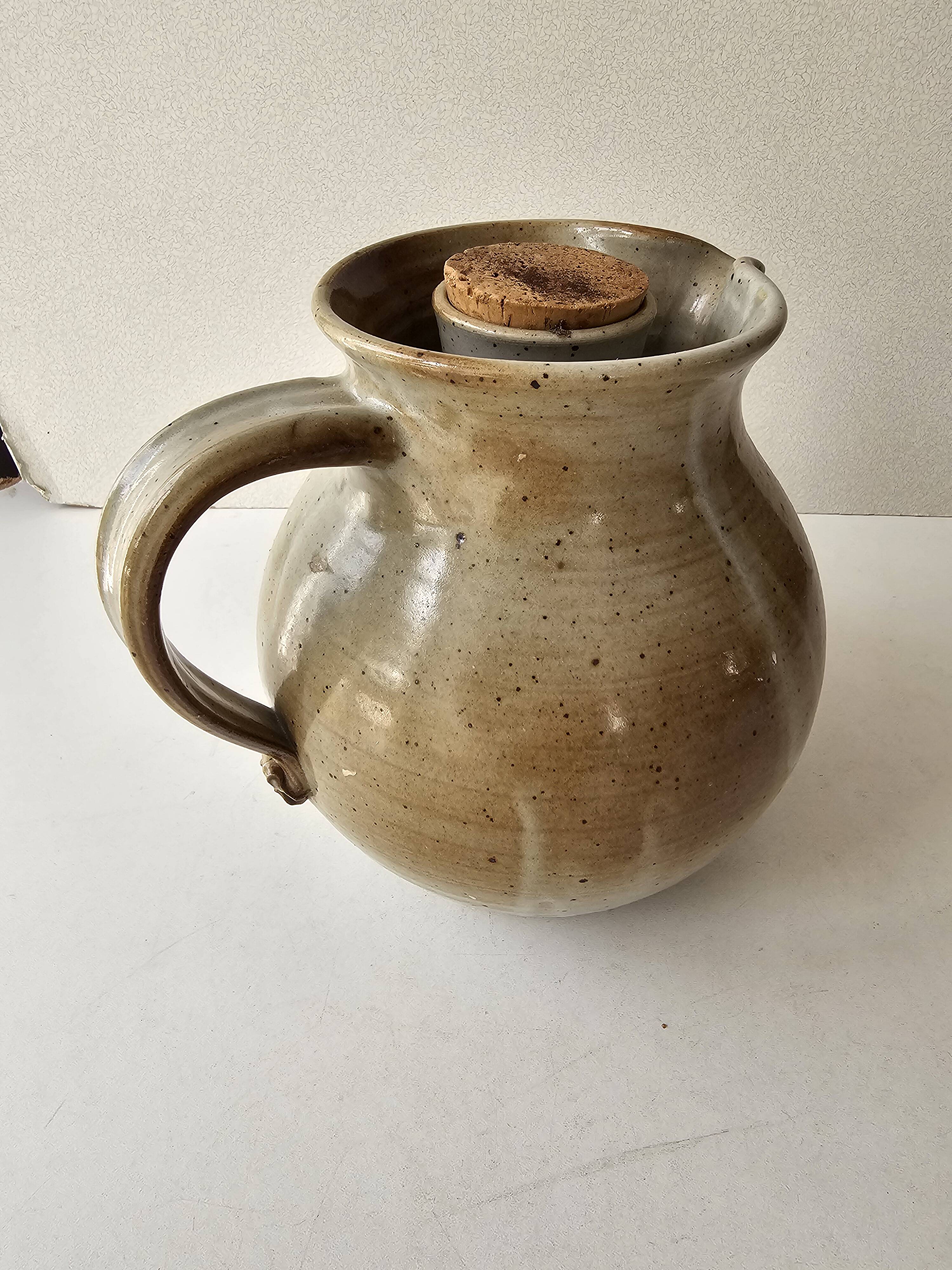 Signed, poured ceramic wine pitcher (signature to be identified)
