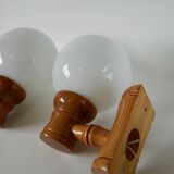 Pair of globe wall lights in pine and opaline from the 60s