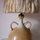 Lamp with sandstone handles