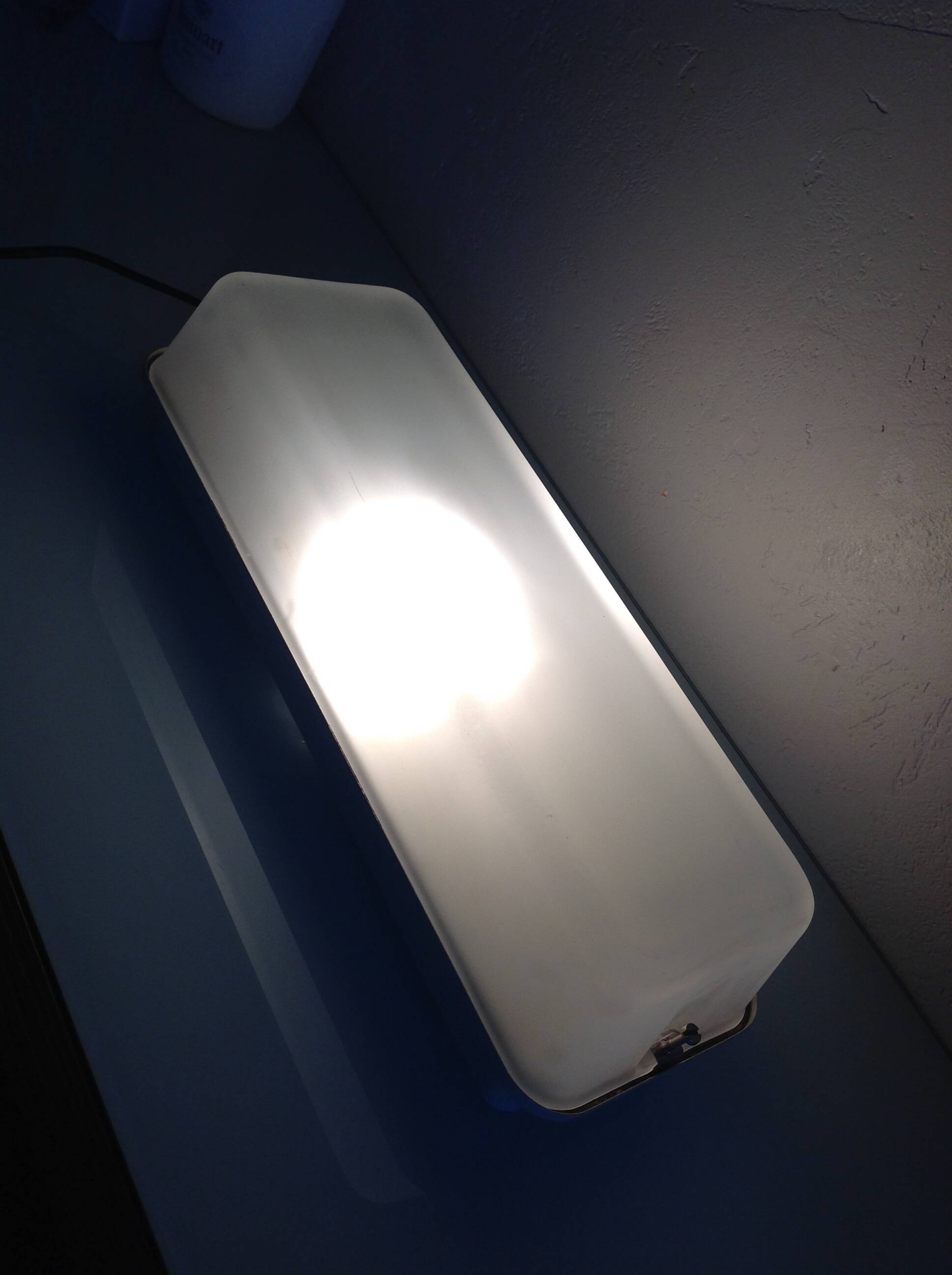 Rectangular porthole wall light in industrial/70s style frosted glass