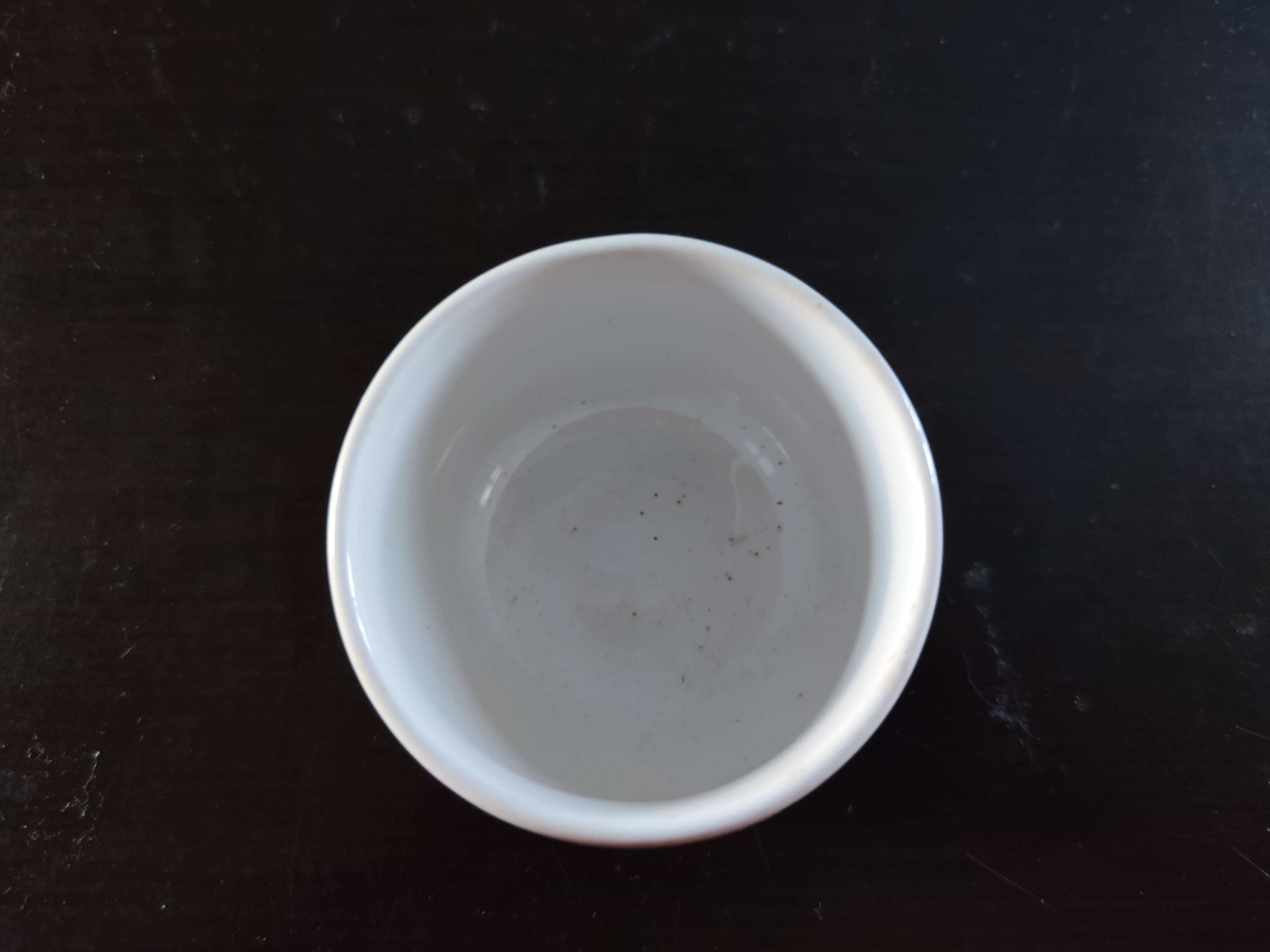Service of small six cups for tea, cream, fruit salad or coffee
