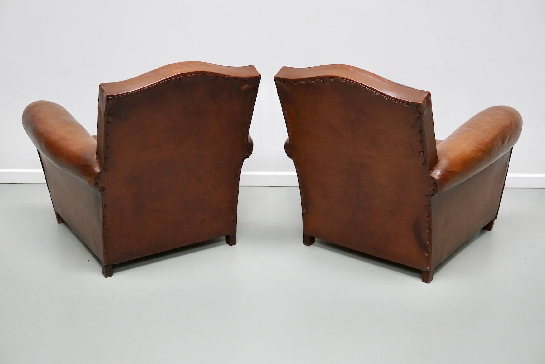 Pair of French Cognac Moustache Back Leather Club Chairs, 1940s