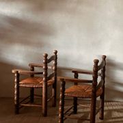 Pair of French spindle chairs in the style of Charles Dudouyt.
