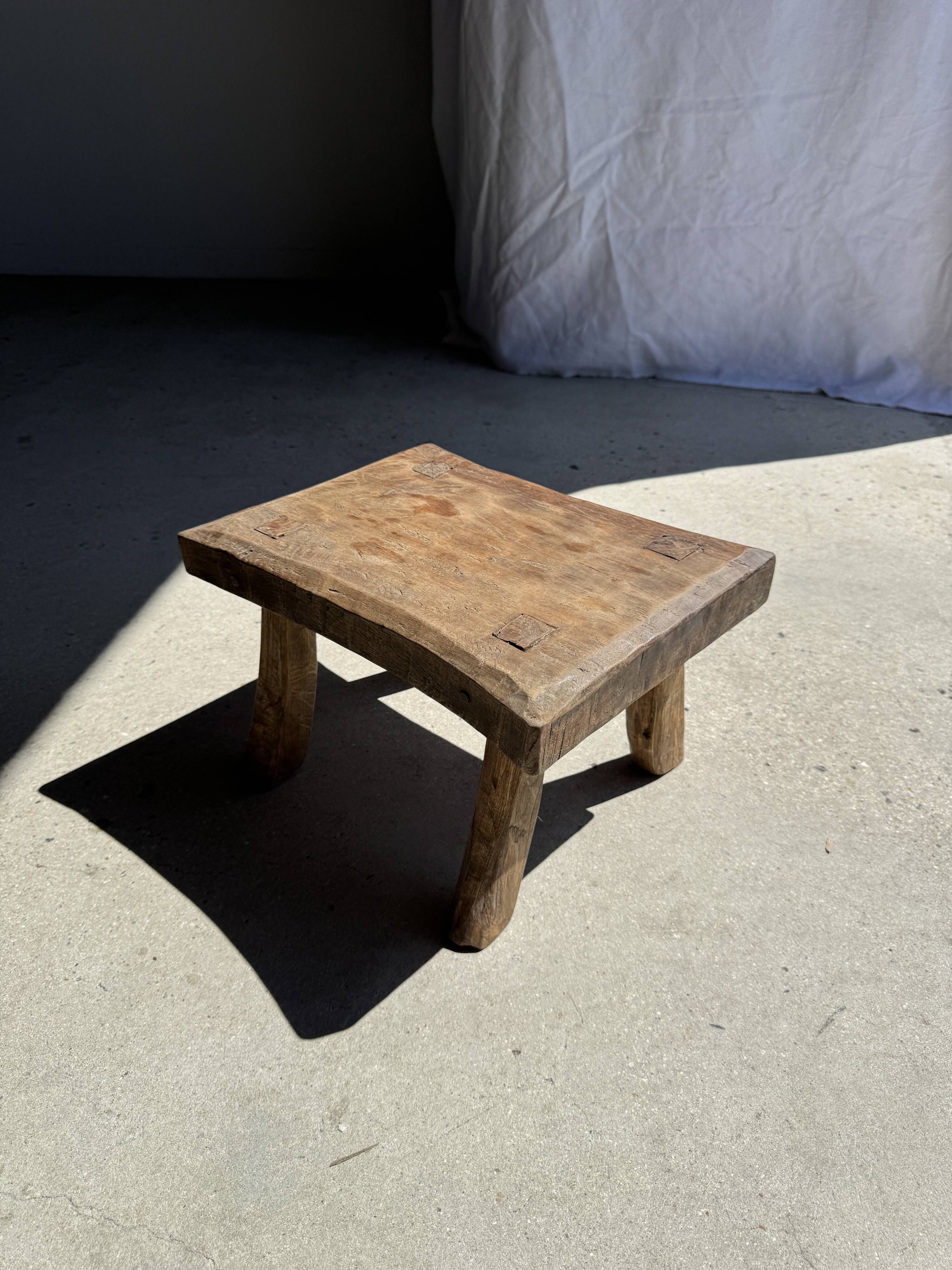 Small stool, rectangular curved accent stool in solid teak.
