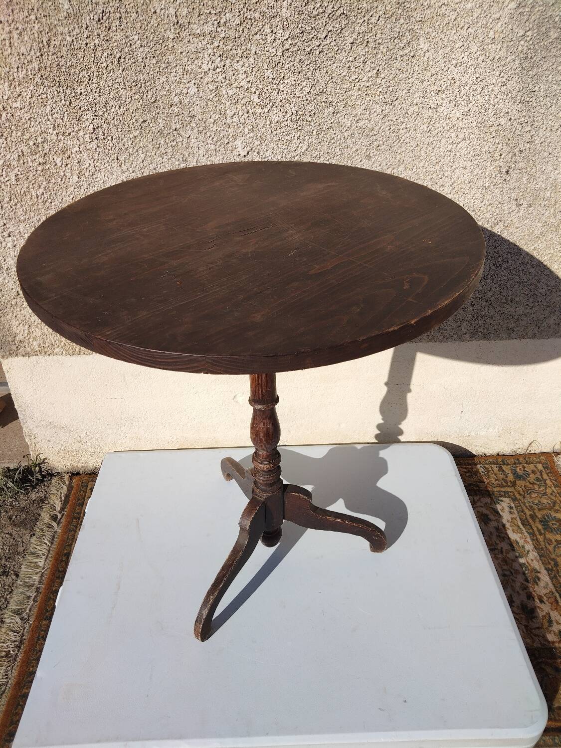 Small rustic antique tripod side table made of solid wood.