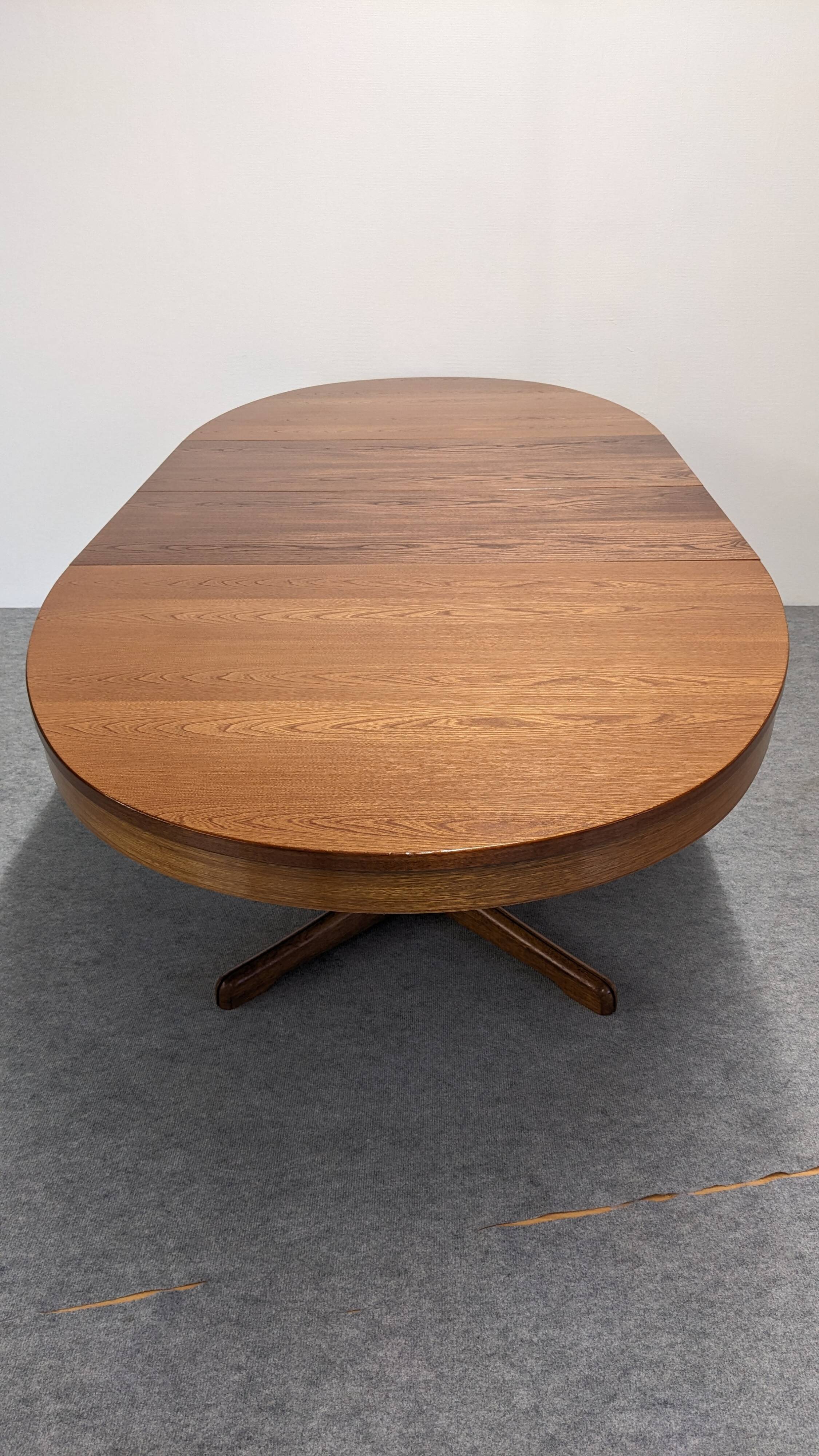 Oval extendable dining table by Baumann, France circa 1970.