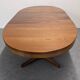 Oval extendable dining table by Baumann, France circa 1970.
