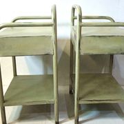 Copy of a pair of patinated metal bedside tables.