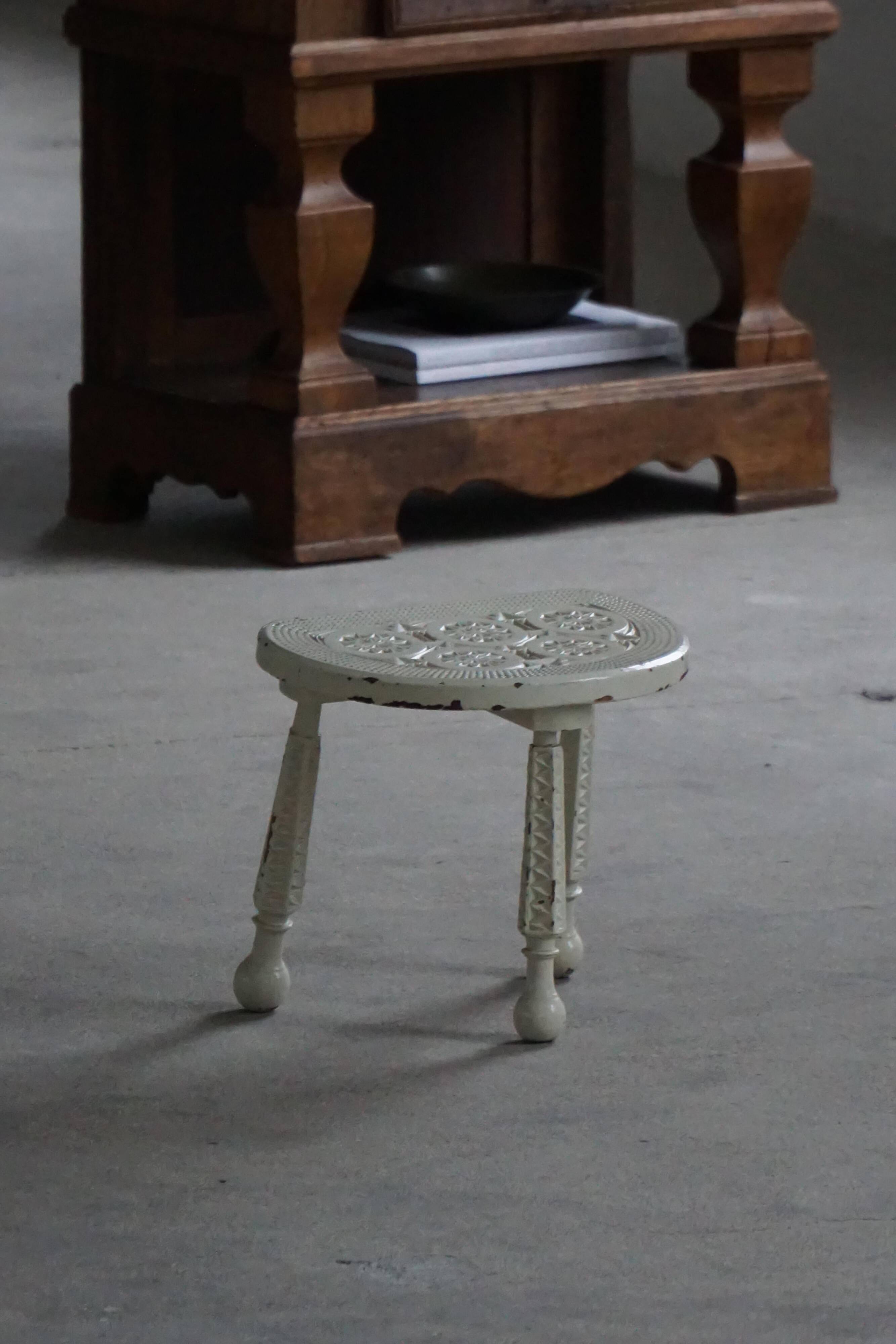 Tripod wooden stool with carved details, early 20th century Danish, 1930s.