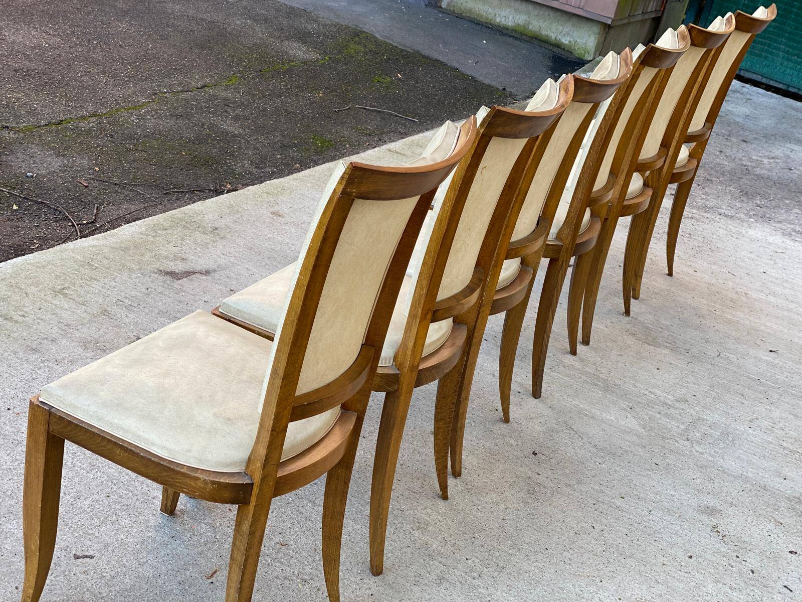 6 Italian Scandinavian style dining chairs from the 1950s in wood and leather.