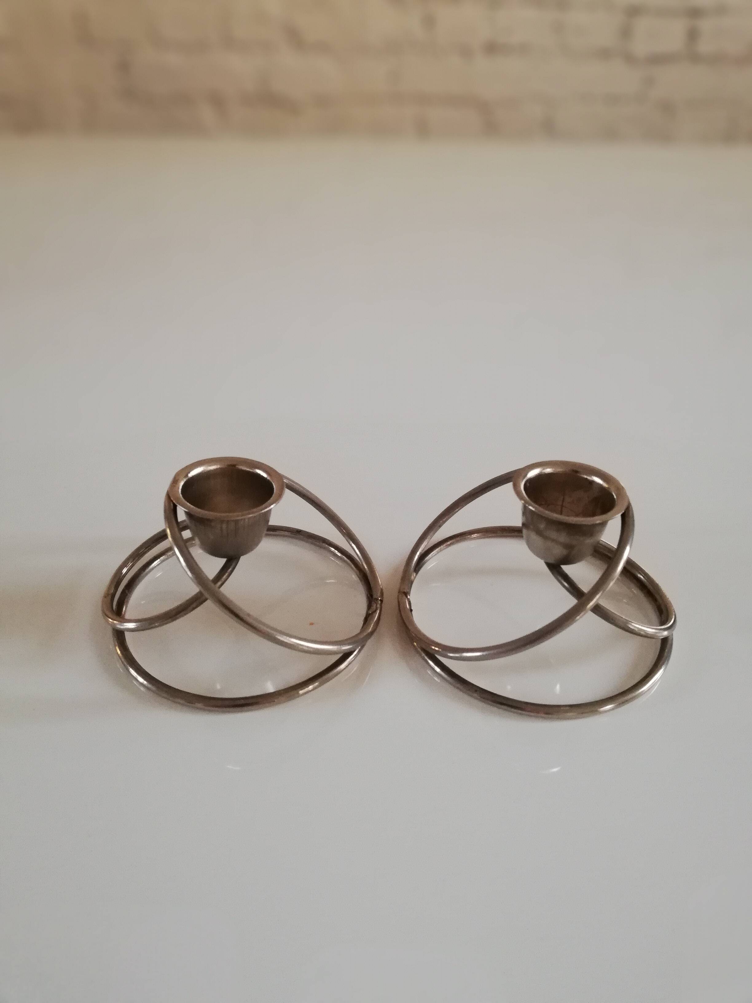 Pair of white metal candle holders