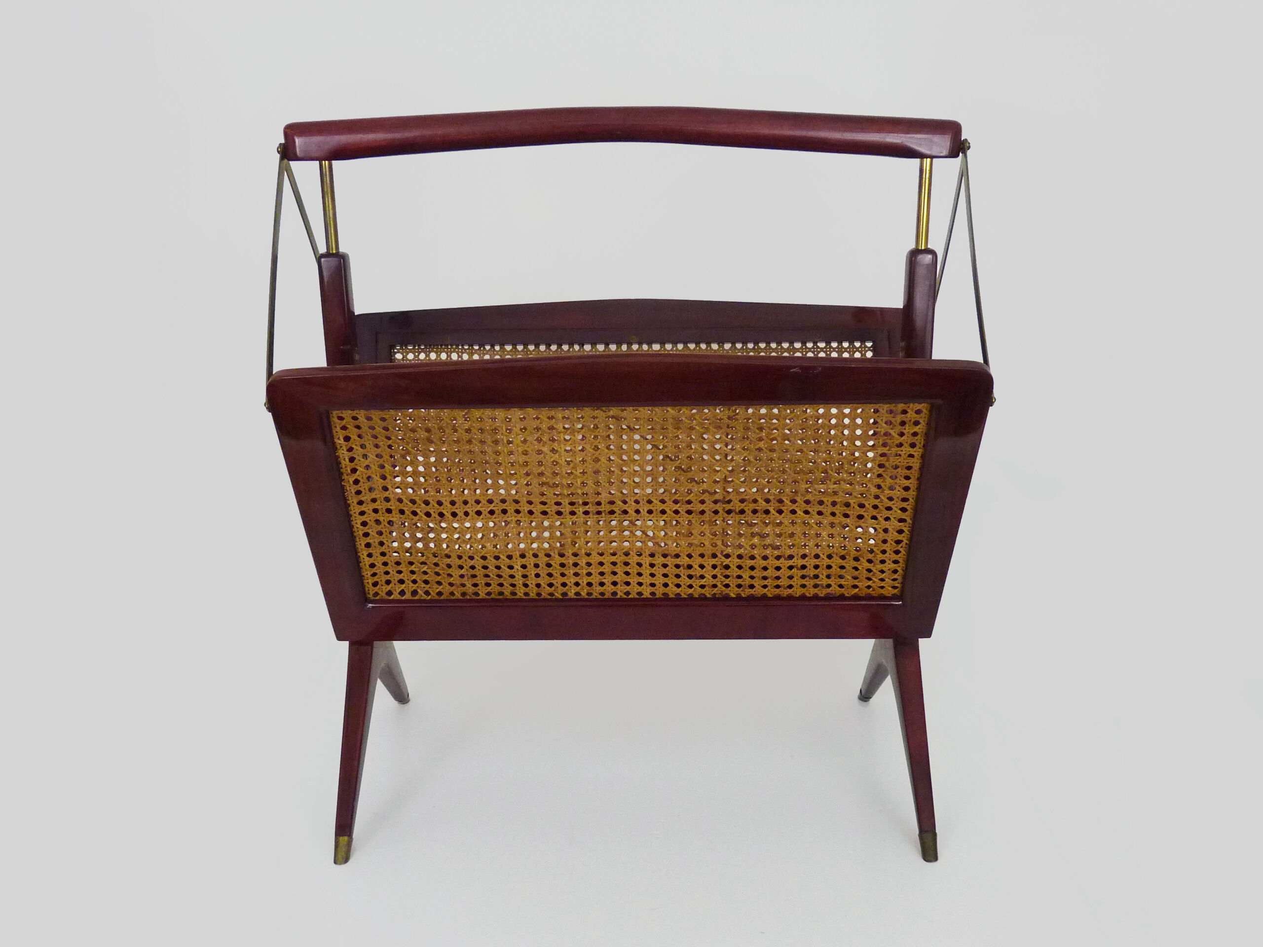 Magazine holders, italy, 1950s. walnut, canage, brass