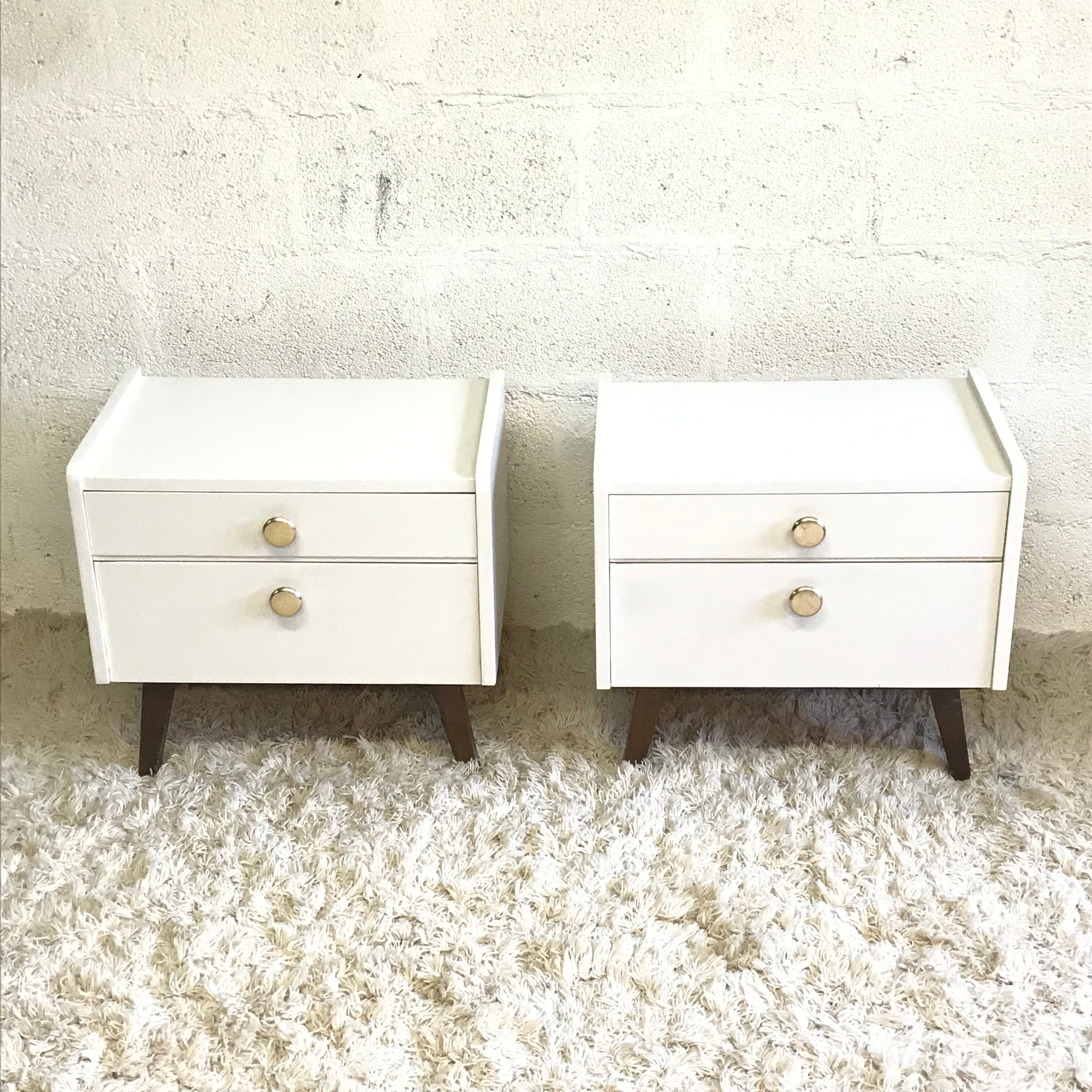 Pair of bedside tables with compass feet