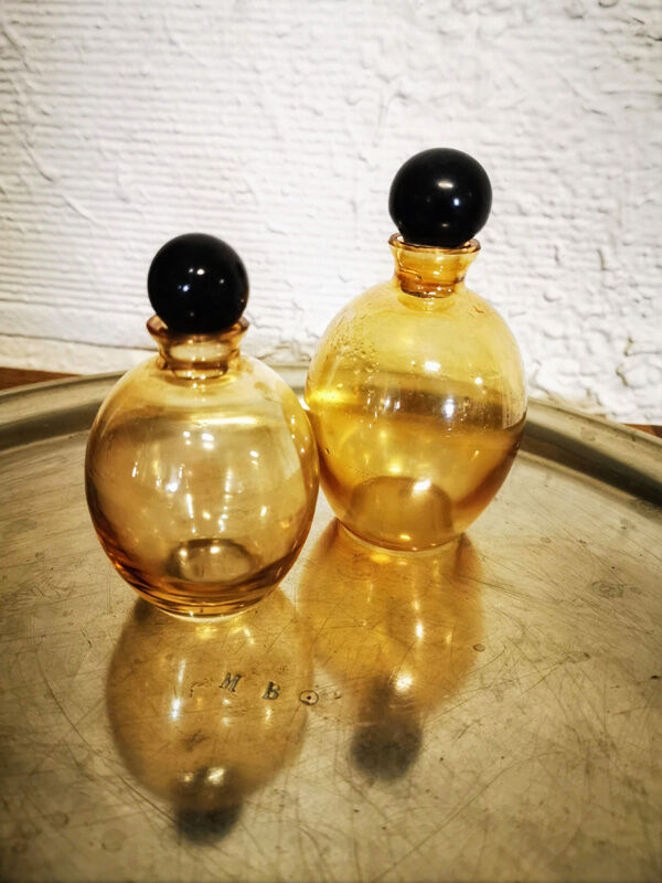 Duo of small amber bottles