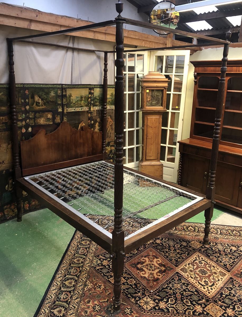Four-poster bed in late 19th century mahogany
