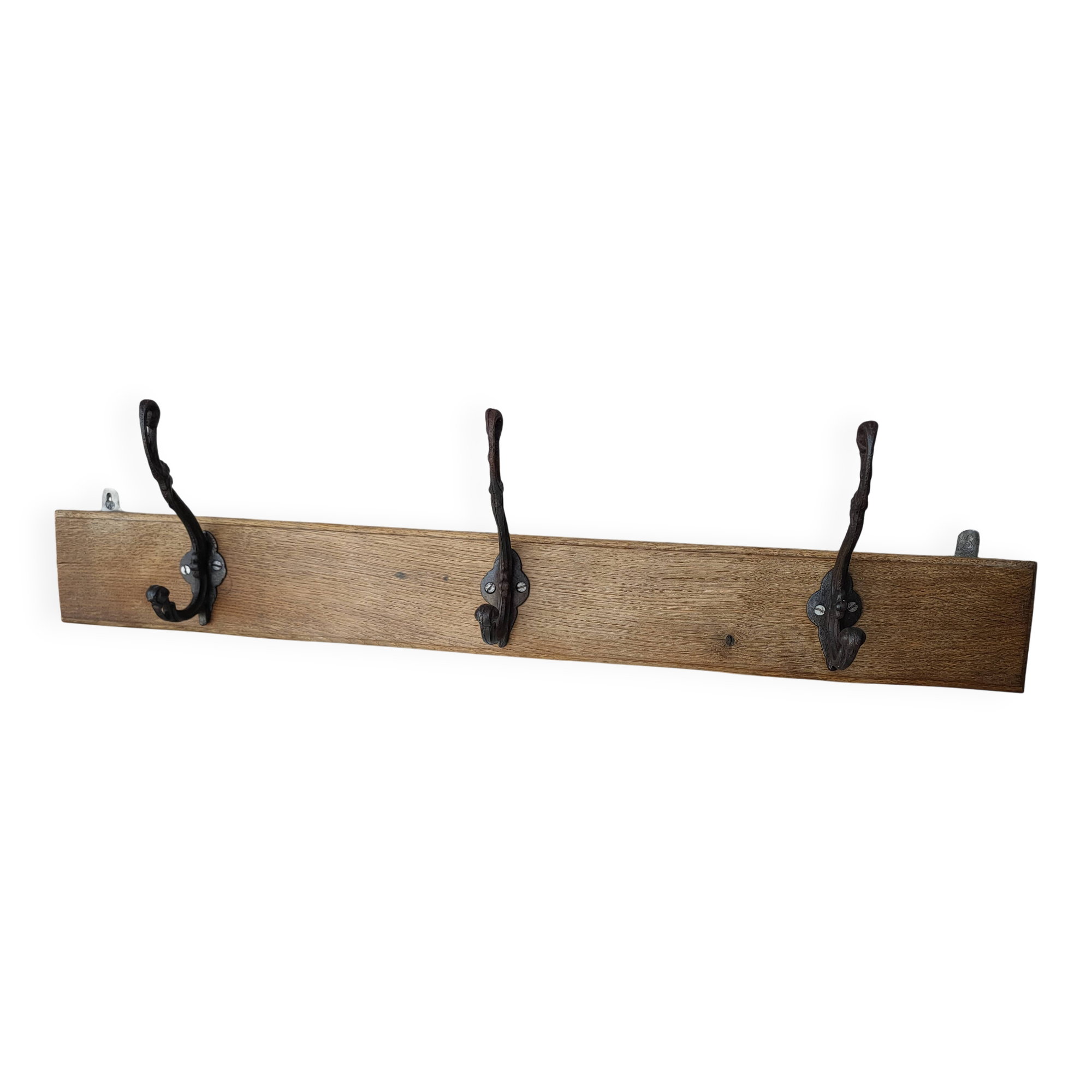 antique coat rack with 3 cast iron hooks