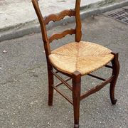 Louis XV 18th century solid wood dining chair with a straw seat.