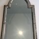 Mirror consisting of multi-faceted mirrors and brass garlands, French work, around 1970