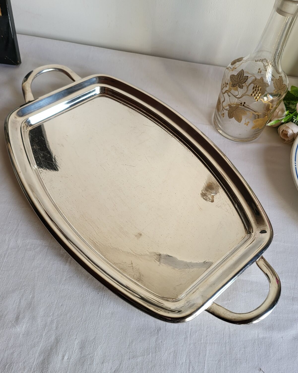 Silver-plated serving dish Quist and its asparagus cradle grid.