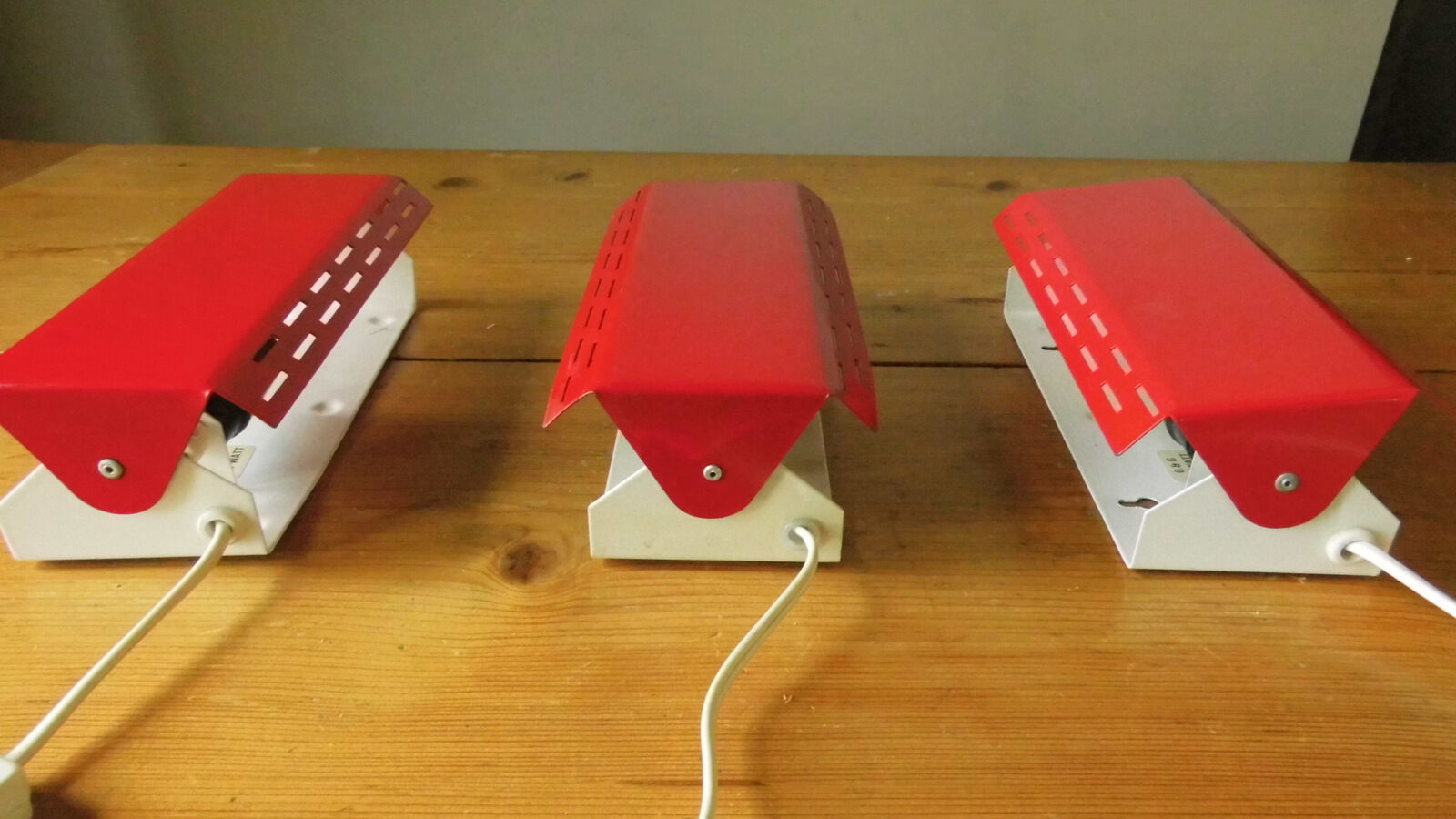 Wall lamp with red swivel shutter