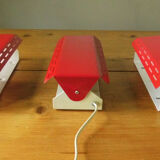 Wall lamp with red swivel shutter