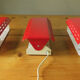 Wall lamp with red swivel shutter