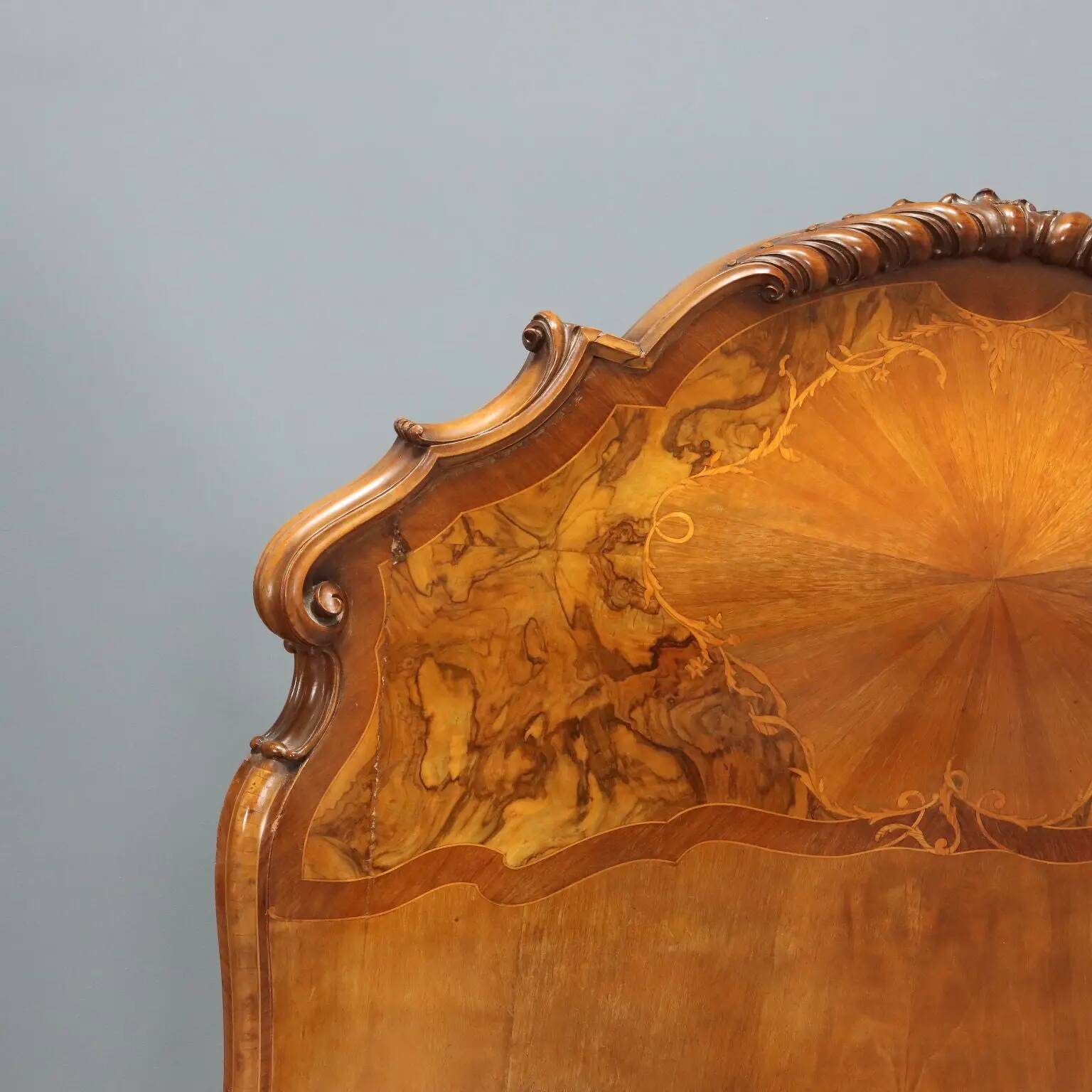 Simple old baroque-style beds in various woods from the 20th century.