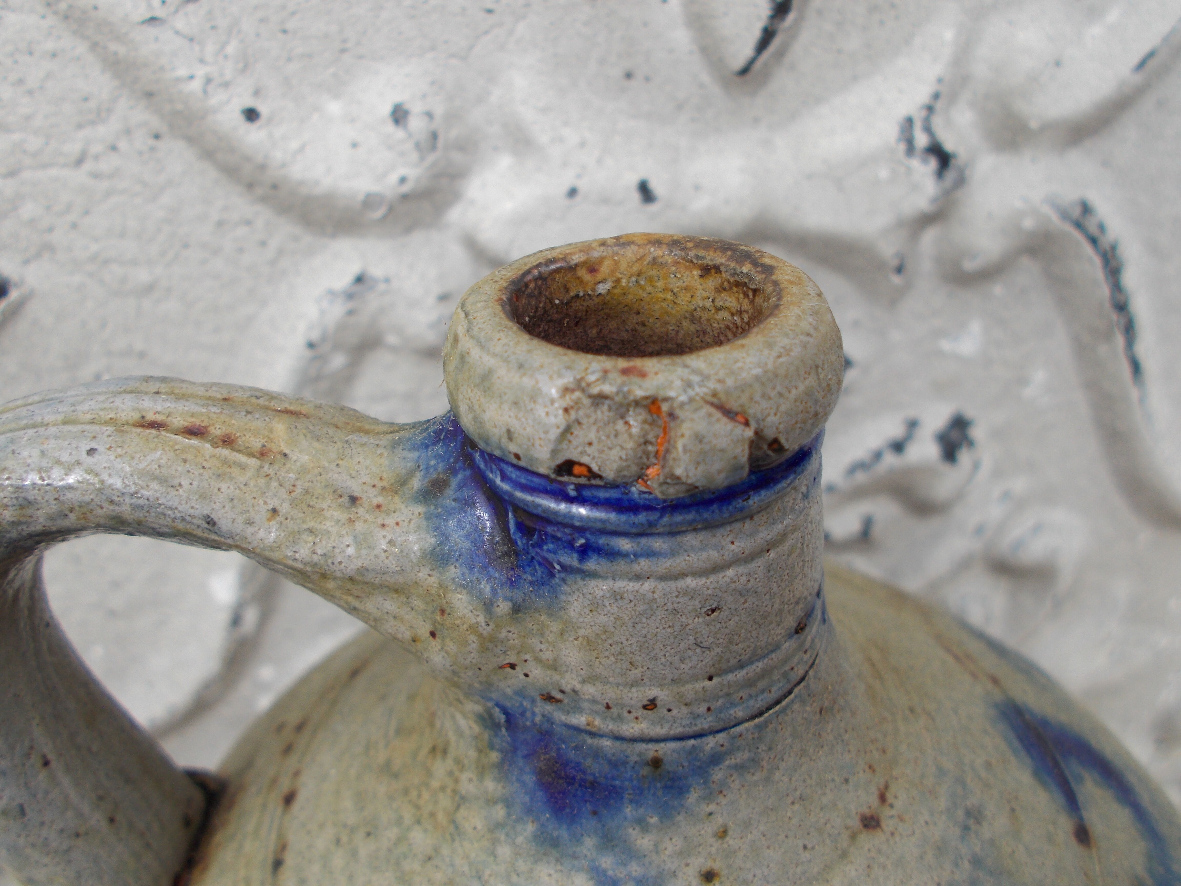 Old potiche jug in sandstone of Alsace