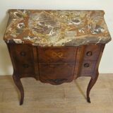 Louis XV style commode with a projection in marquetry.