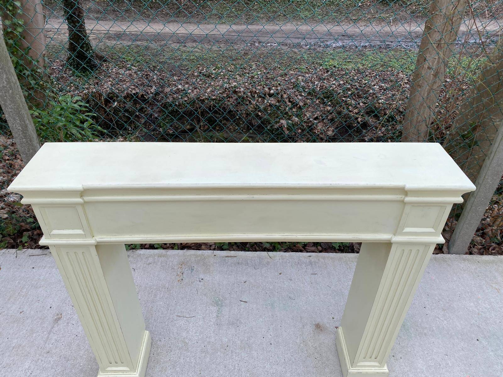 Fireplace surround with beige solid wood mantel