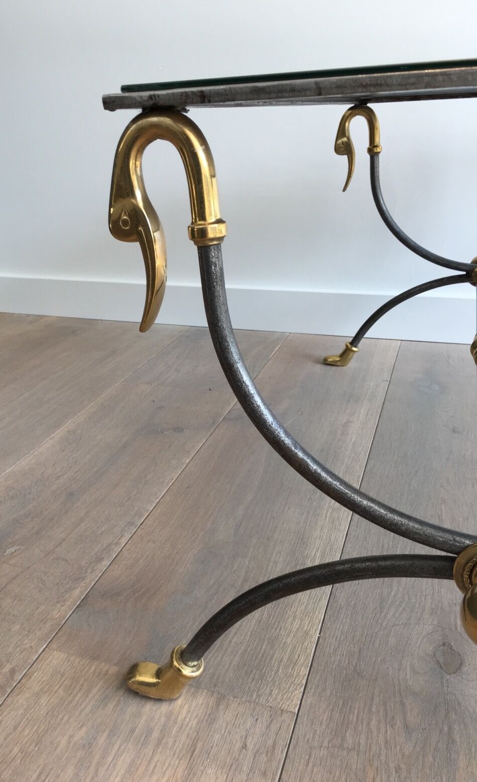 Coffee table in brushed steel and brass