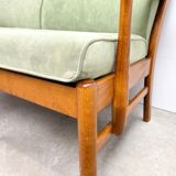Two-seater sofa from the sixties with green upholstery