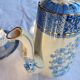 Old coffee service Lunéville with blue lace decoration.