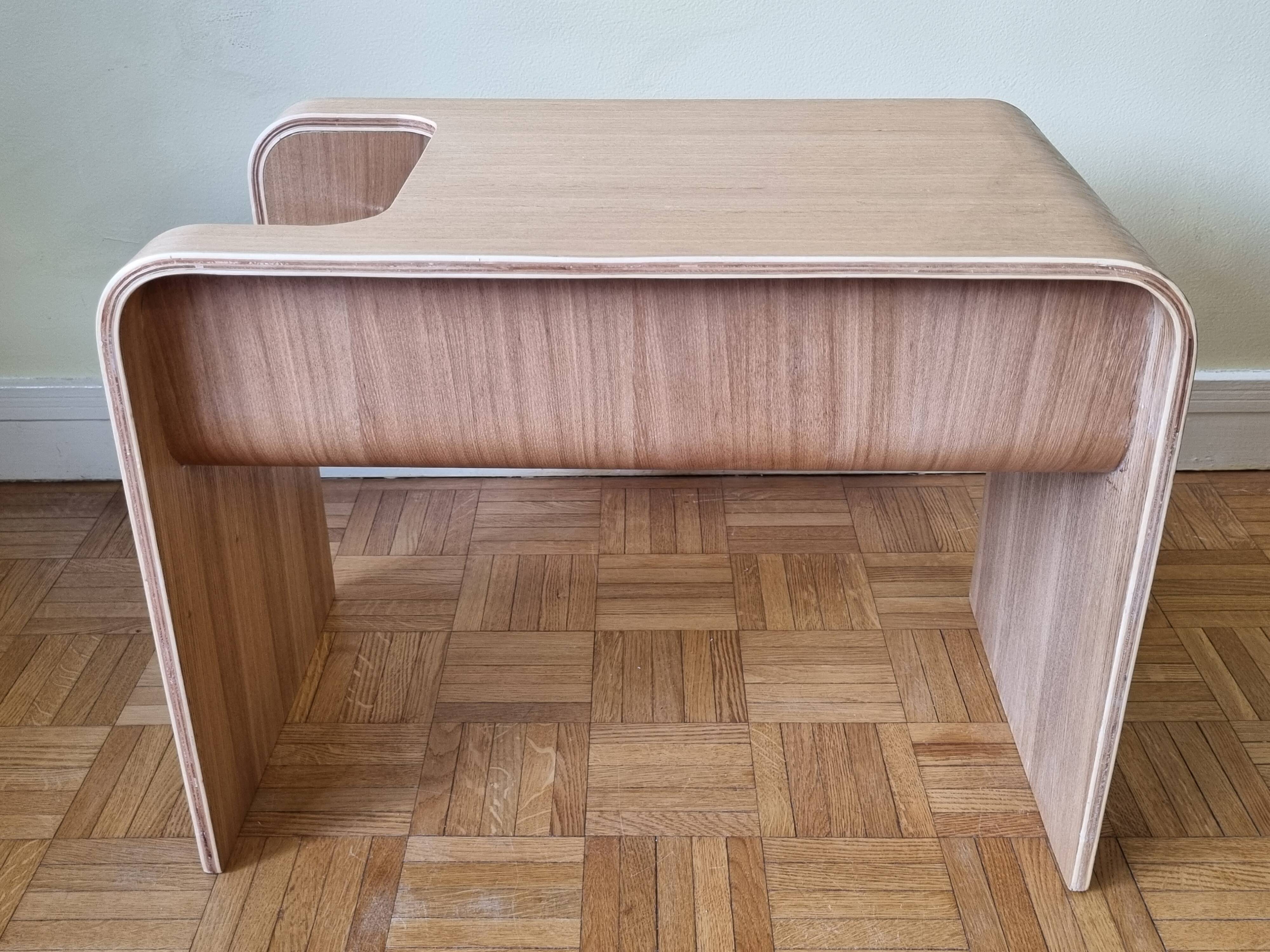 Boone coffee table in curved wood produced by Habitat, design