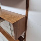 Teak shelving system with glass cabinet, marked made in Denmark, 1960.
