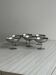 Set of 6 metal footed bowls in shiny finish.