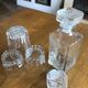 Mismatched decanter and whiskey glasses