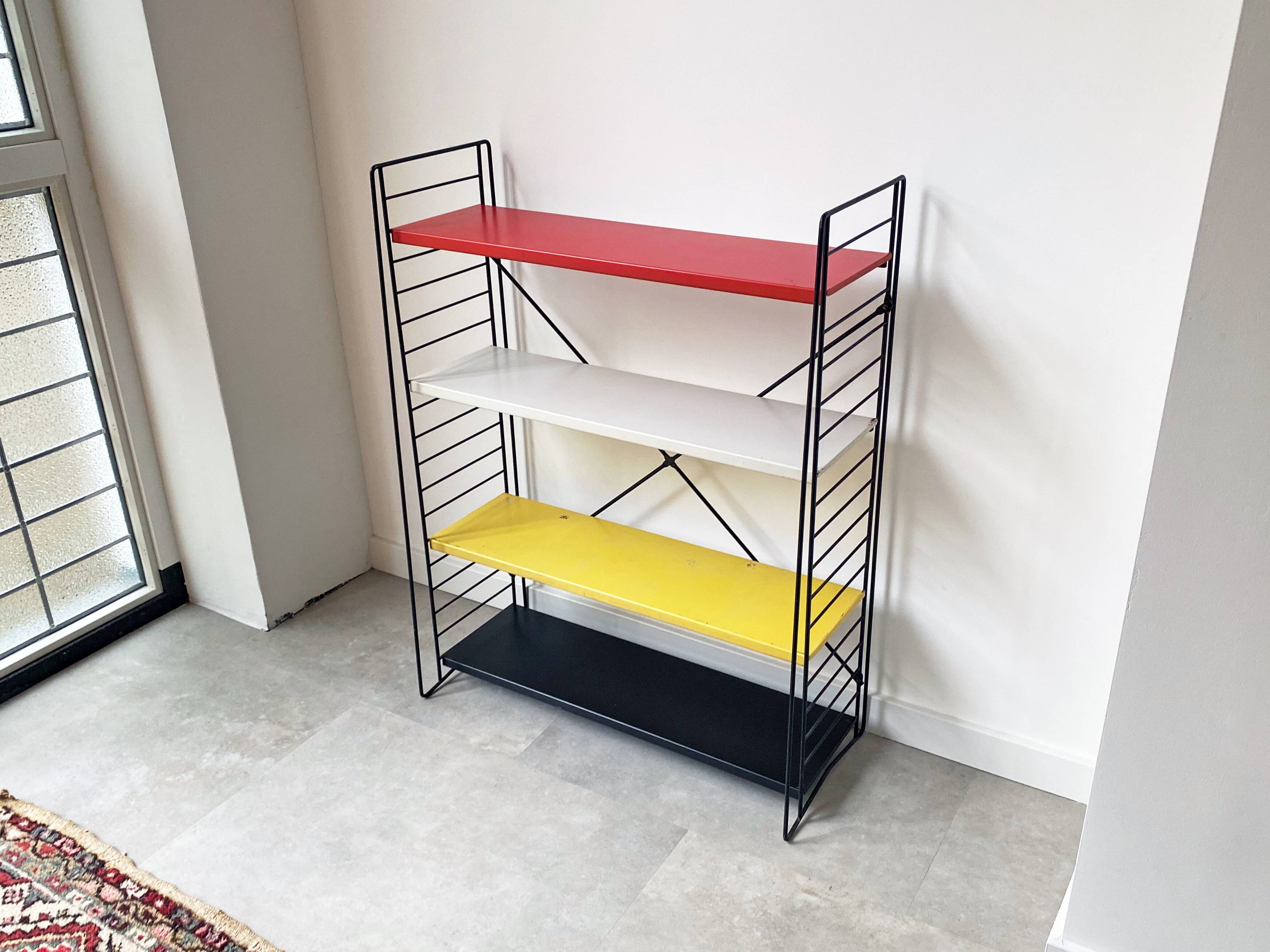 Mid century free standing tomado shelving system / bookcase designed by d. dekker