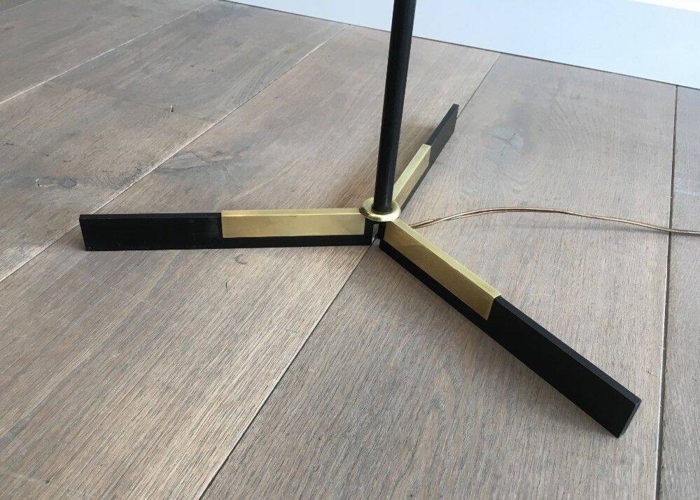 Designer floor lamp in black lacquered metal and brass