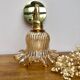 Gold bent wall light vintage tulip in amber glass.