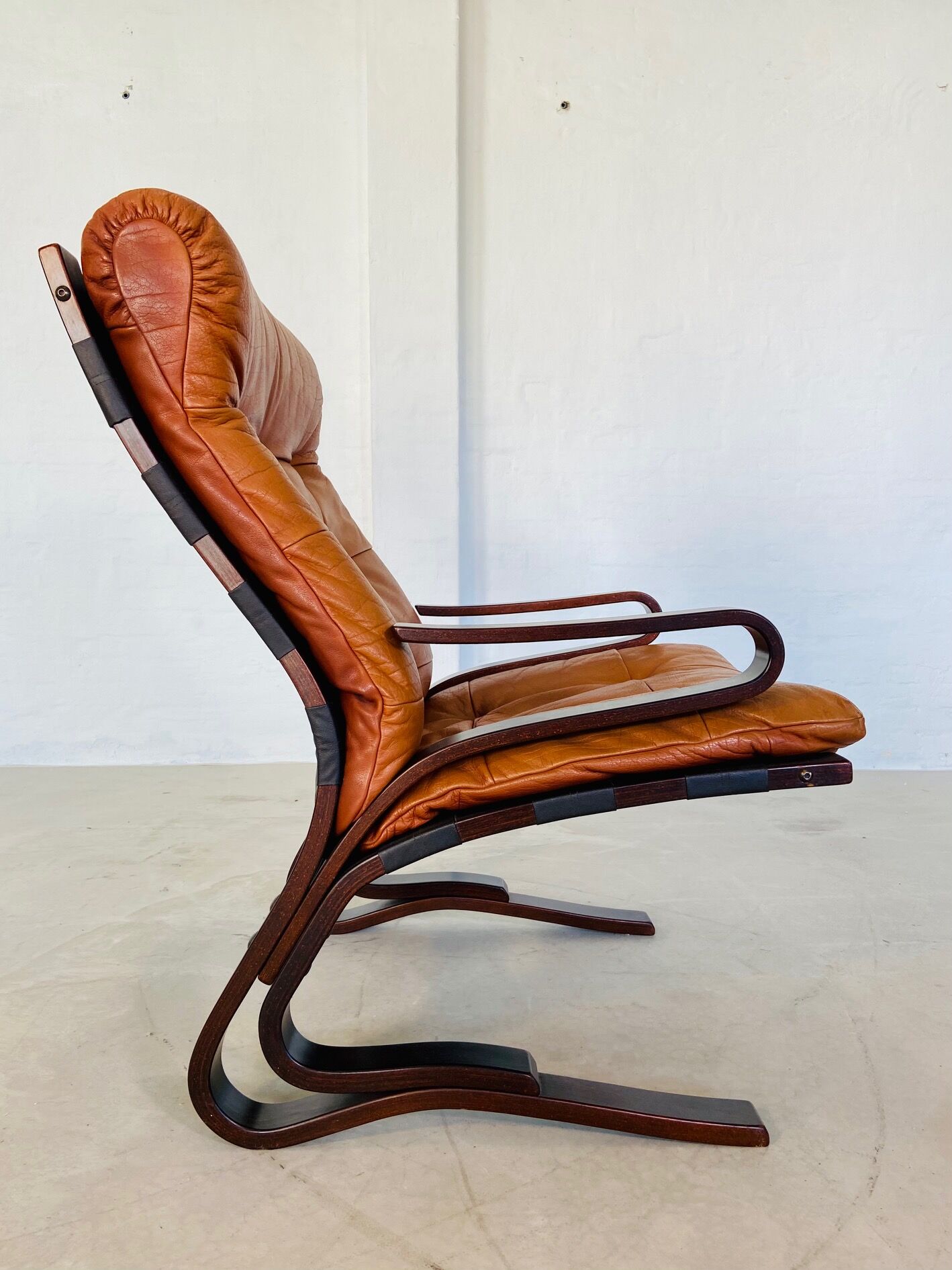 Vintage Scandinavian cognac lounge chair by Oddvin Rykken