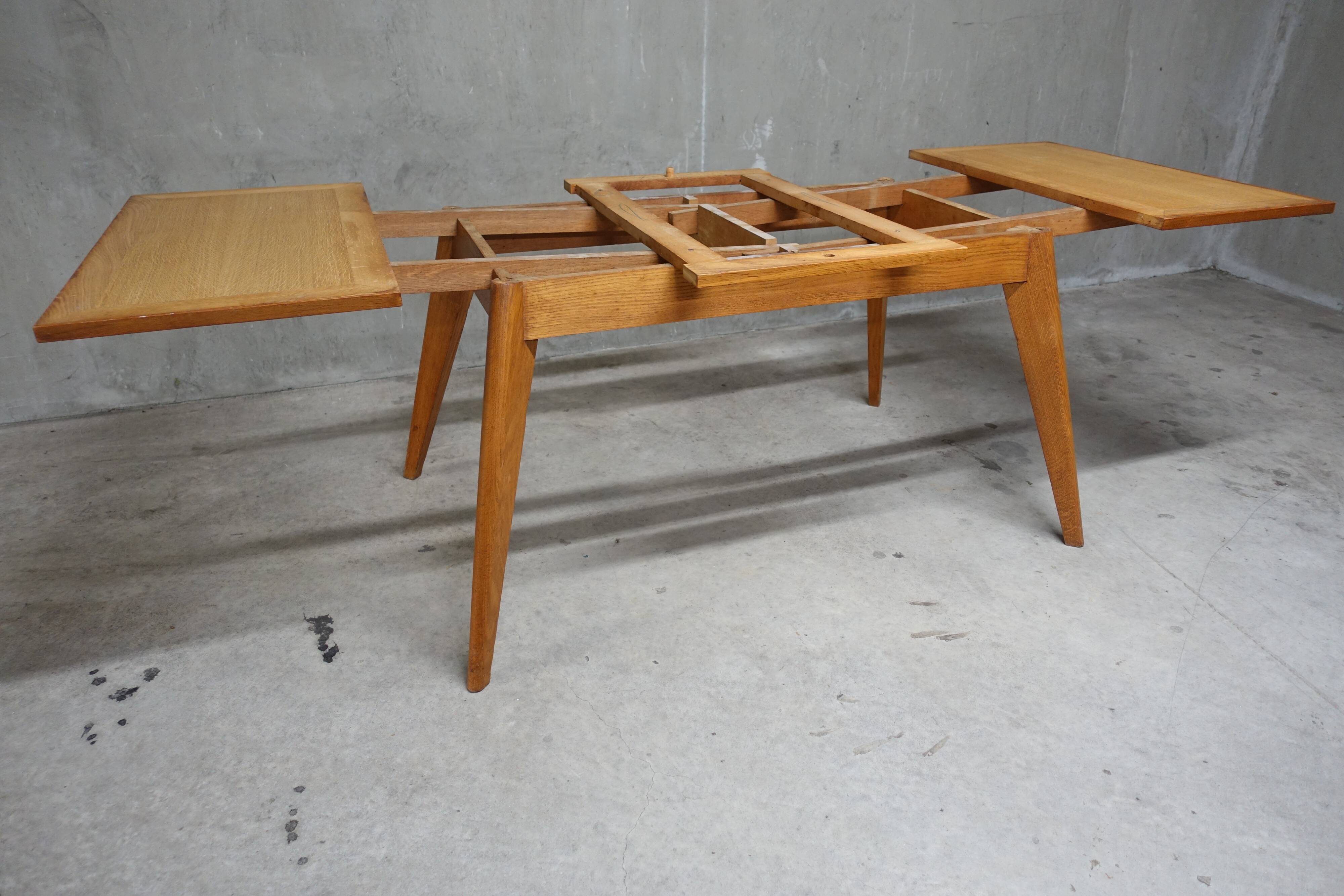 Dining table in blond oak compass feet 1950