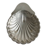 Old metal plate in the shape of a shell.