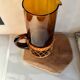Vintage orange and wicker carafe
