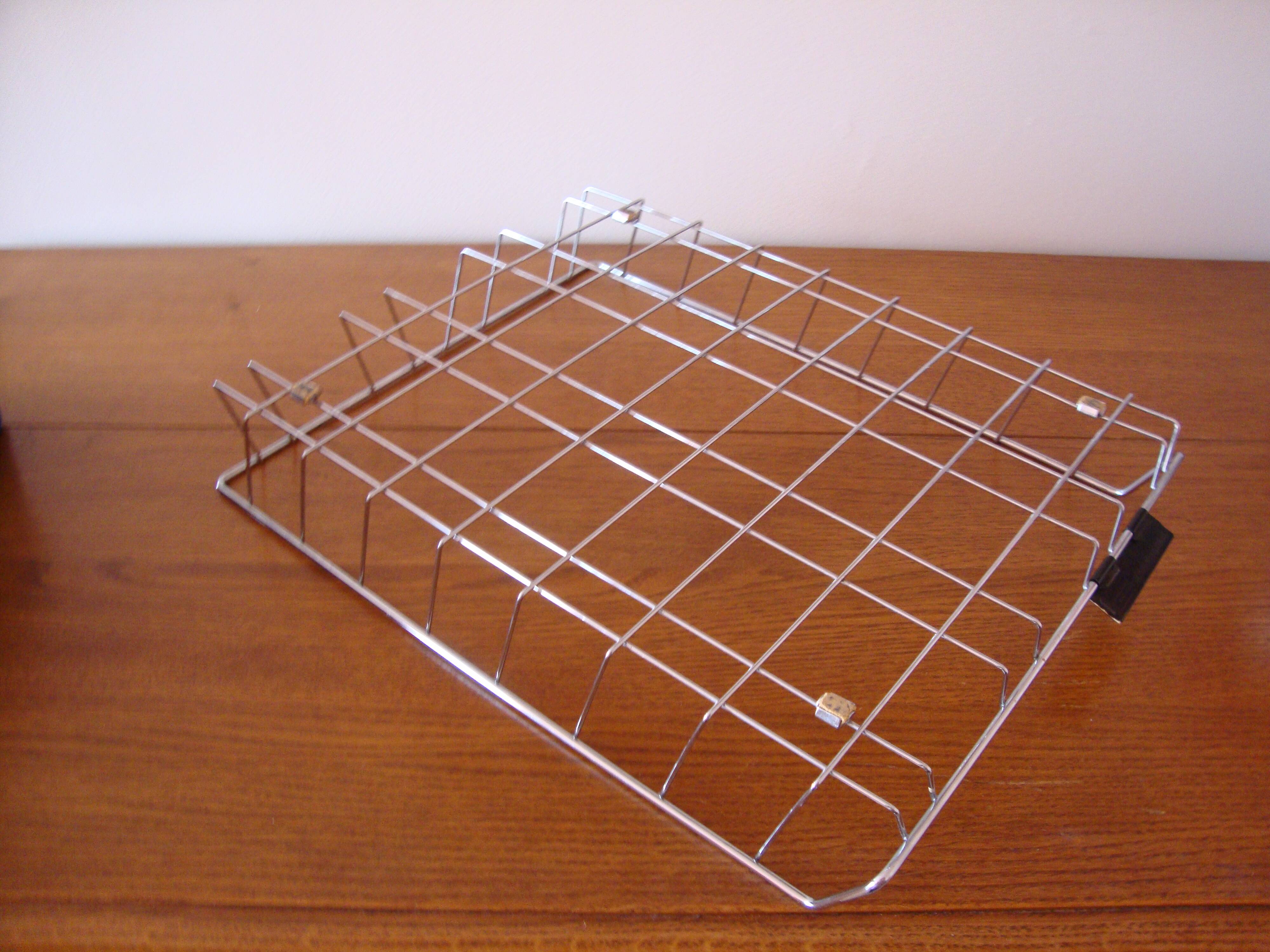 Old stainless steel mail basket from the 1970s