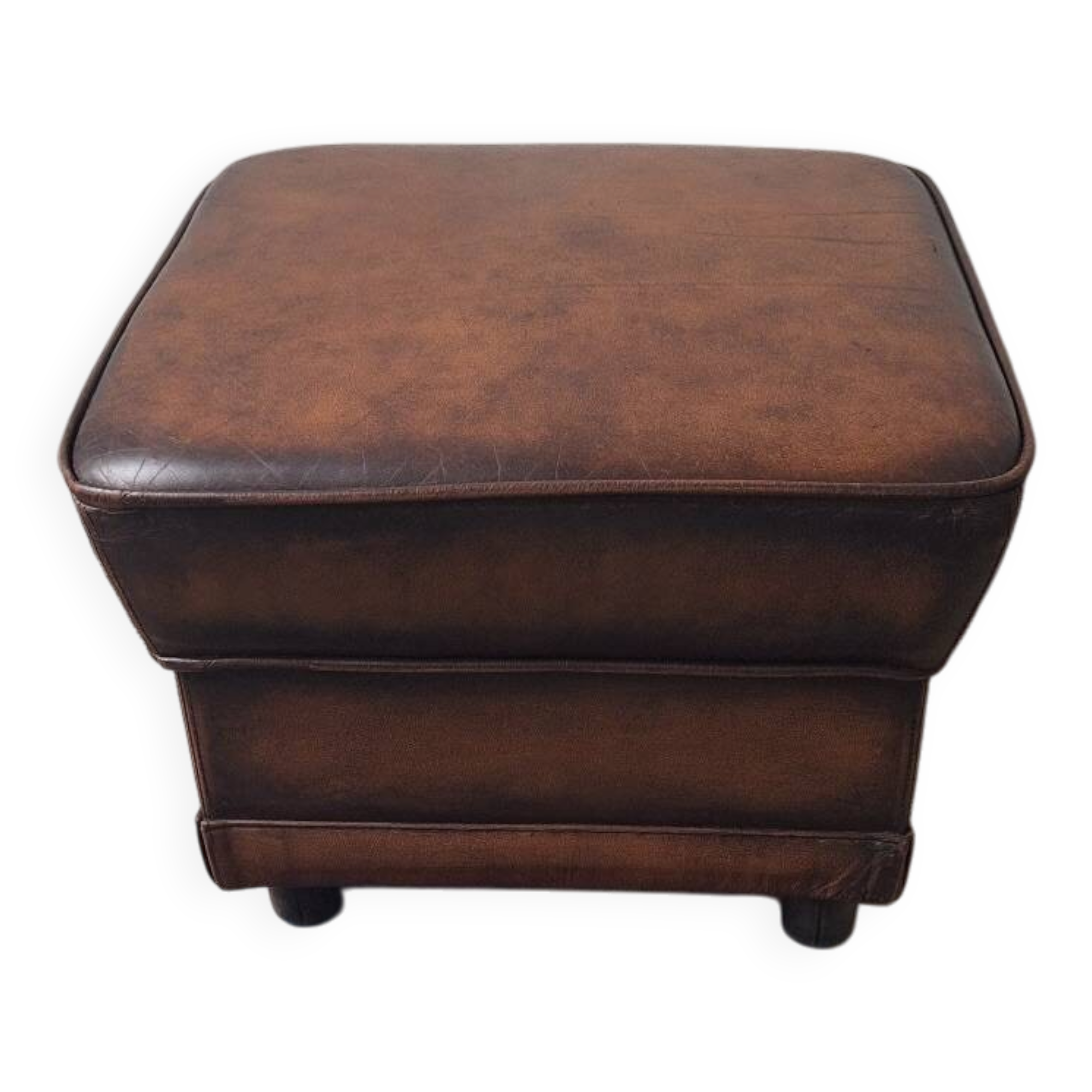 Vintage ottoman / pouffe in chestnut brown leather