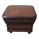 Vintage ottoman / pouffe in chestnut brown leather