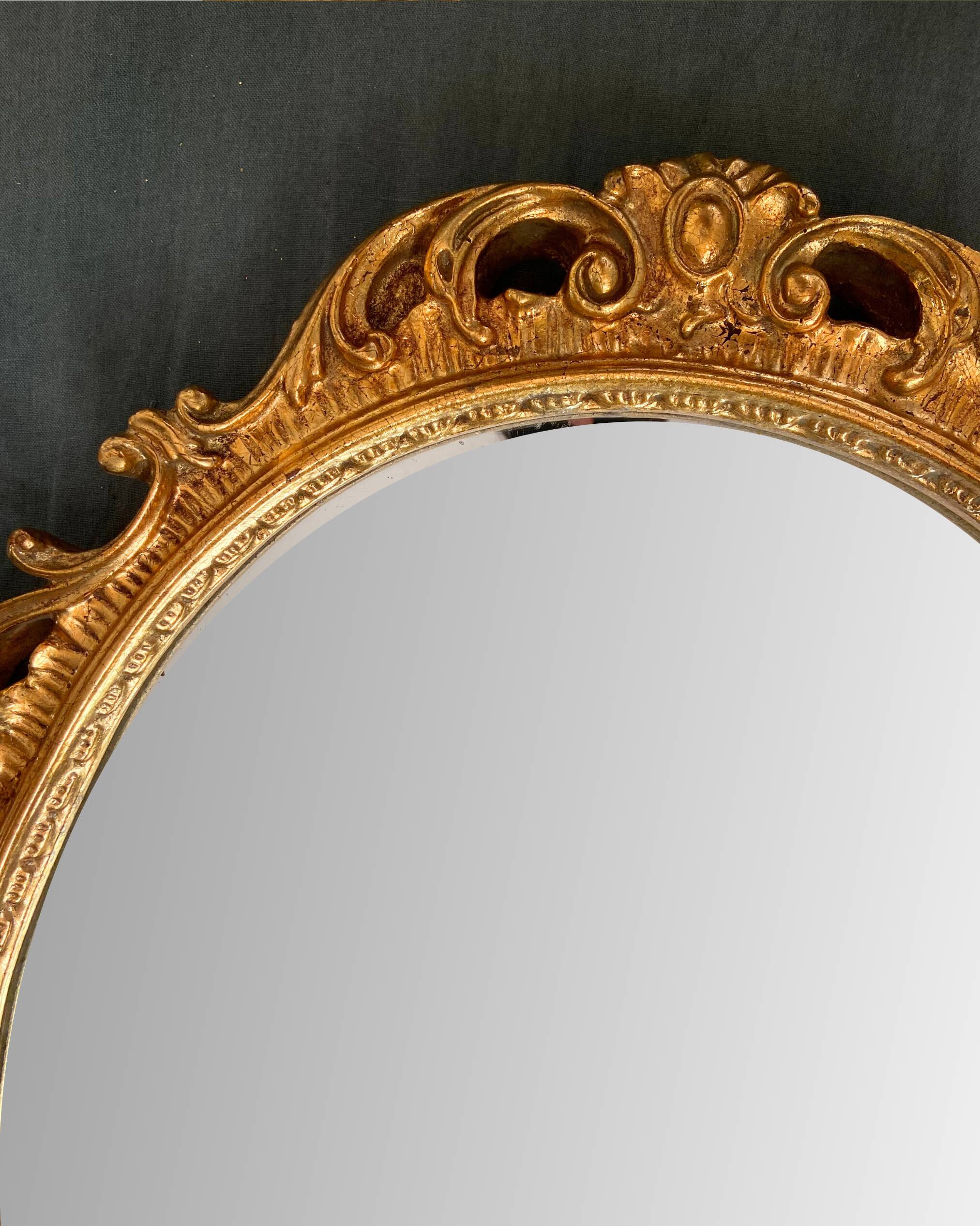 Beautiful Baroque Style Oval Decorative Mirror - Gilded with gold leaf with a Beautiful Patina