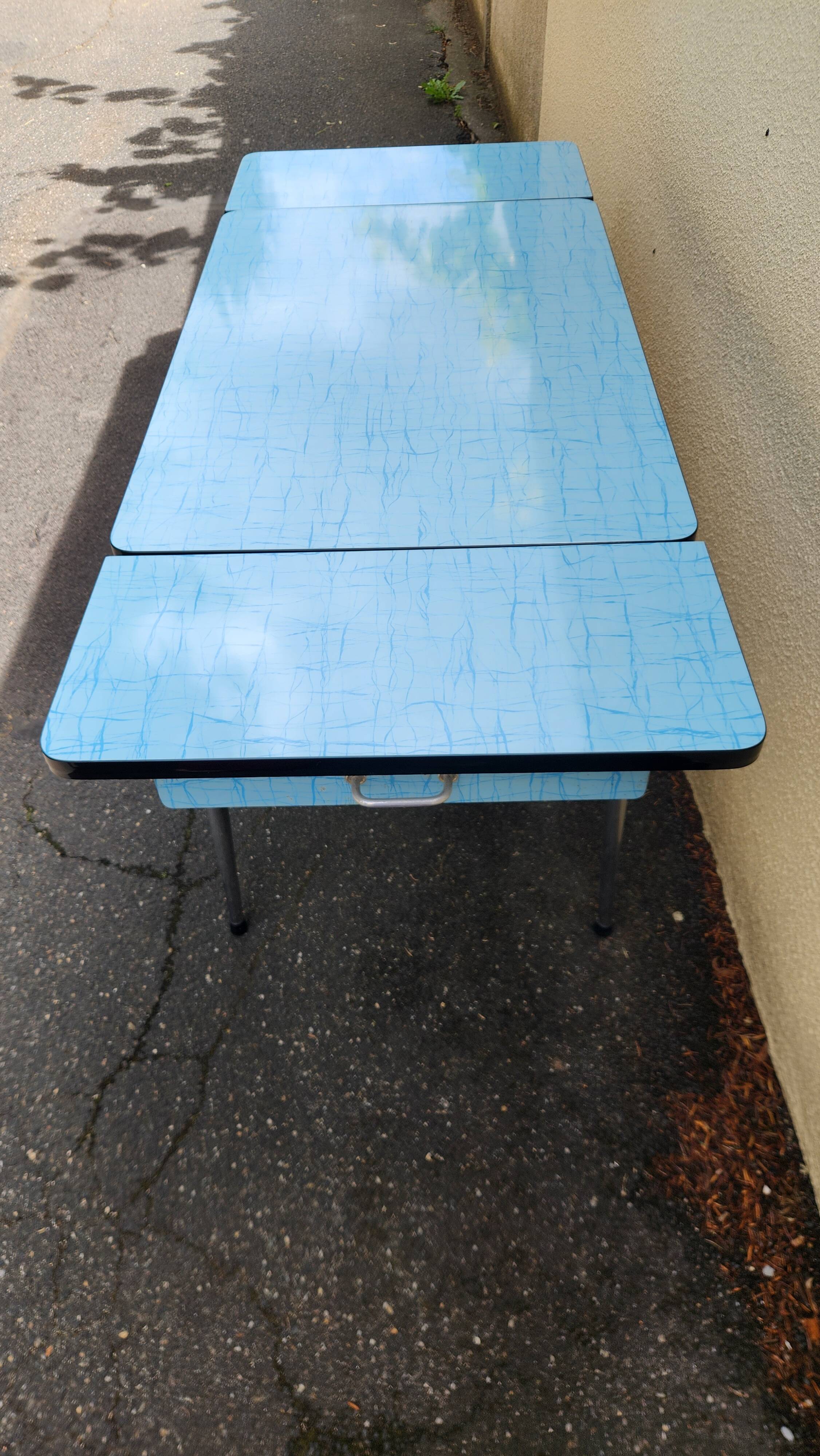 Vintage set from the 60s/70s: table, chairs, and marbled Formica stools.